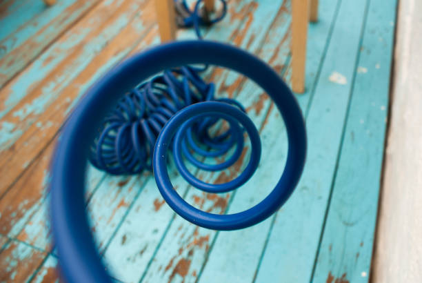 Macro, closeup of a blue hose from the center. Spiral loop of the pipe.