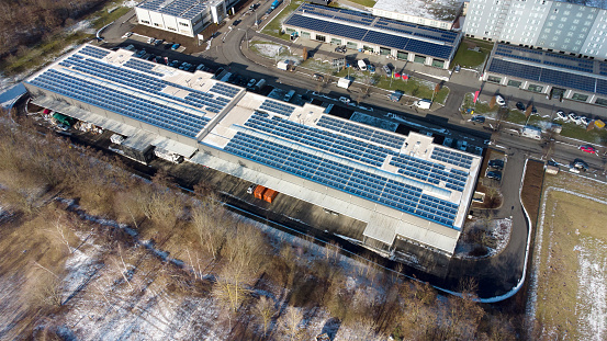 Rooftop and solar panels of storage building - aerial view