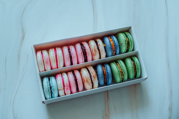 istock top view on the macaroon box. gift. valentine's day. small cake or coo 1301814597