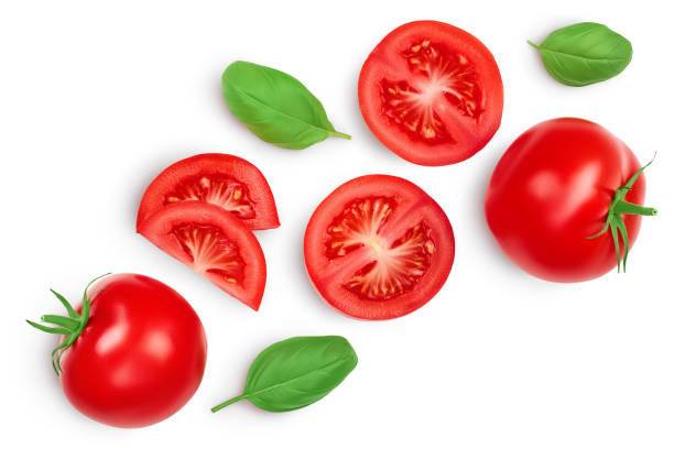istock Tomato slices with basil leaf isolated on white background. Clipping path. Top view with copy space for your text. Flat lay 1301815364