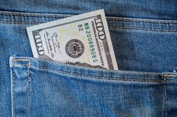 istock One hundred dollars in jeans pocket. 1301815840
