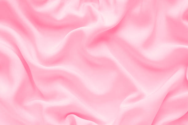 tejido rosa de lujo de fondo abstracto con pliegues ondulados, textura de seda, - soft pink fotografías e imágenes de stock