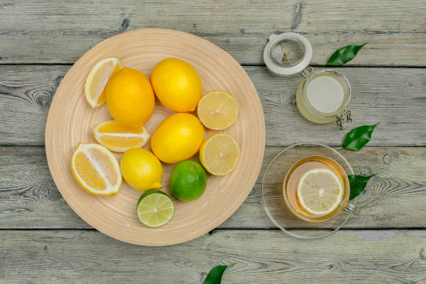 istock lemon tea with lemon and lime on wooden table 1301822312