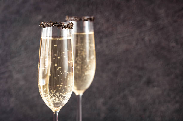 Flutes of champagne Flutes of champagne with black caviar rim caviar stock pictures, royalty-free photos & images
