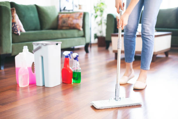 istock Woman holding mop and plastic bucket 1301827098