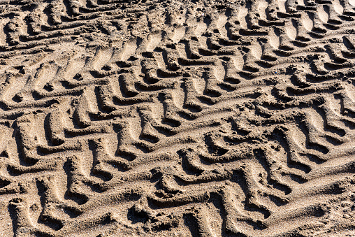 Tractor tire trail on the sand in Turkey.