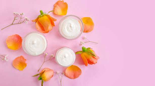istock cream cosmetic rose flower on colored background 1301828763