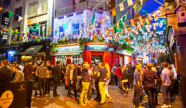 Nightlife in Dublin old town, Ireland Dublin, Ireland - June 2020: Nightlife in Temple Bar area temple bar pub stock pictures, royalty-free photos & images