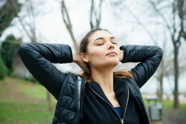 istock Beautiful young woman warming up before workout 1301830810