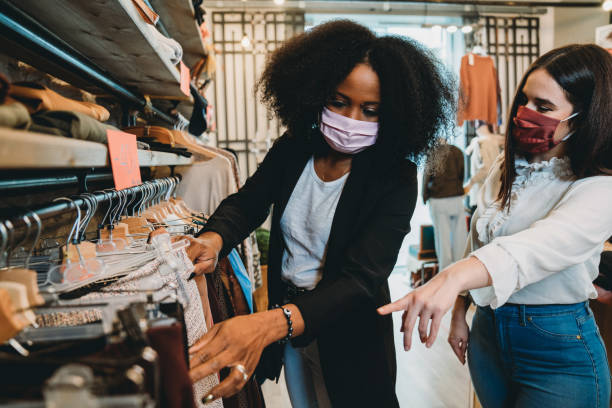 istock Two friends going shopping together 1301833114