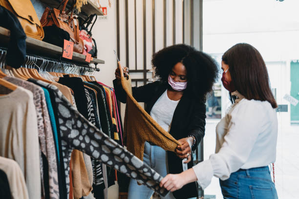 istock Two friends going shopping together 1301833119
