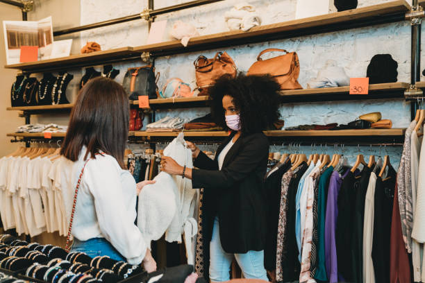 istock Saleswoman with a customer in a small retail 1301833122