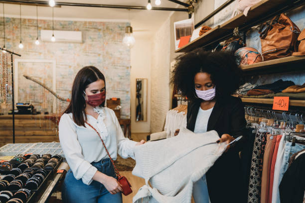 istock Saleswoman with a customer in a small retail 1301833126
