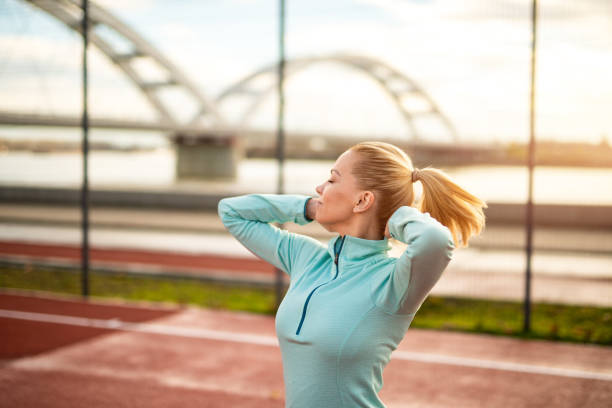 istock Mid adult woman getting ready for training. 1301833701