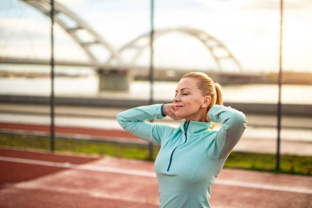 istock Mid adult woman getting ready for training. 1301833781