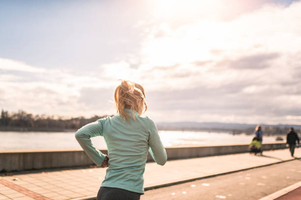istock Young woman running. 1301834848