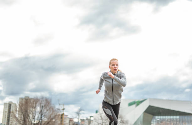 istock Young woman running outdoors. 1301835637