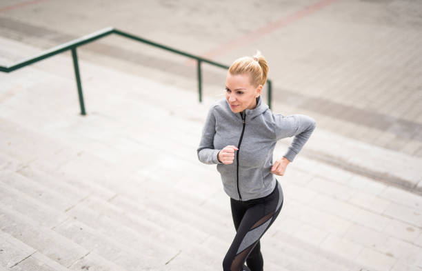 istock Young woman running outdoors. 1301835650