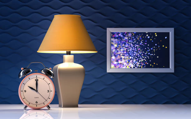 istock Yellow lamp and alarm clock on blue background - interior - 3d rendering 1301836780