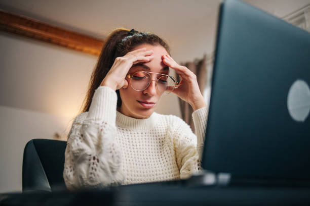 istock Stressed business woman working from home on laptop 1301837581