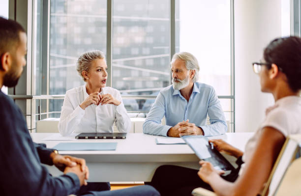 istock Business people having a meeting 1301837760
