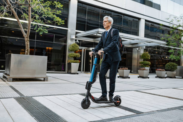 istock Mature Latino businessman on electric scooter going to work 1301840297