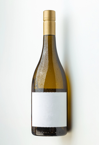 cool white wine bottle with empty label on white background