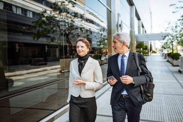 istock Mature Latino business people going home after work, avoiding public transportation due to pandemic 1301840415