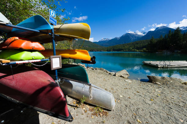 istock Canoes and kayaks by a lake 1301841652