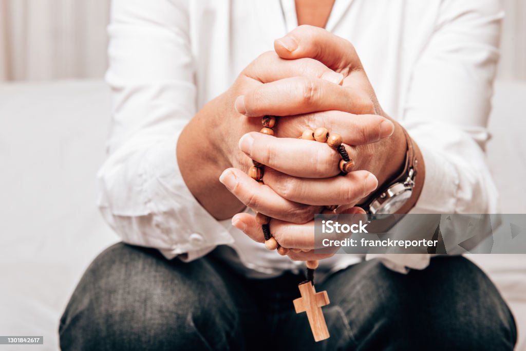 people praying with hands crossed Hand Stock Photo