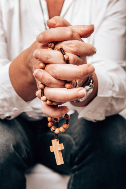 istock people praying with hands crossed 1301842633