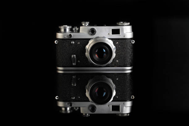 istock The very rare old rangefinder film camera on black background. 1301843283