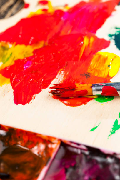 istock mixed on a wooden palette of multi-colored paints 1301843688