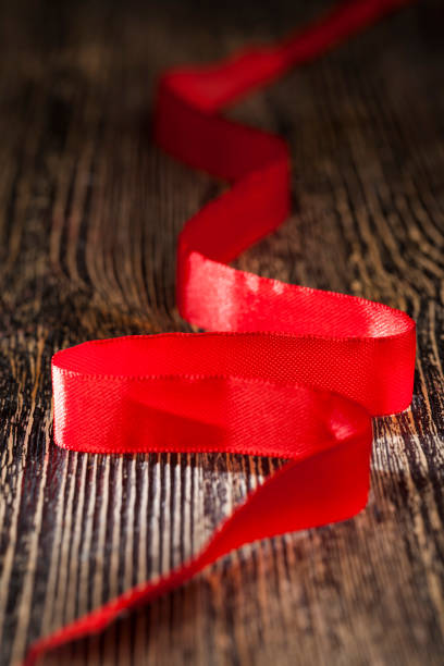 istock beautiful red satin ribbon 1301843701