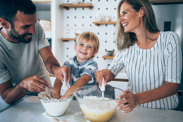 istock Family cooking together. 1301844660