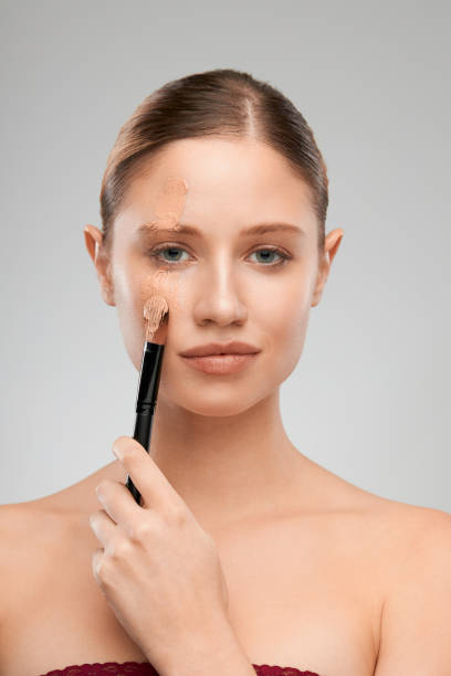 istock Beautiful blonde with nude makeup posing in studio. 1301848288