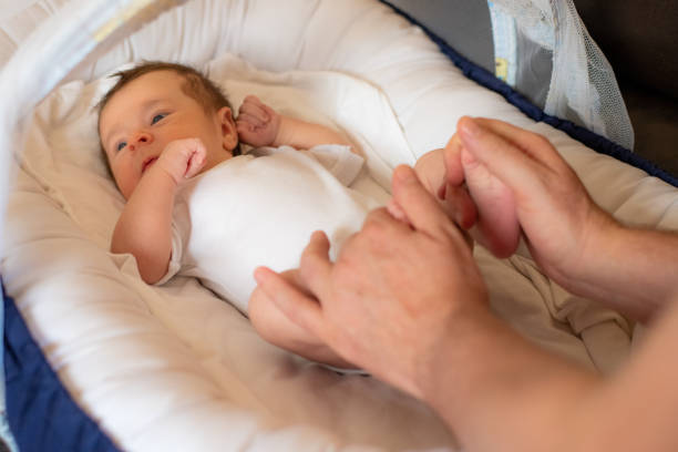 istock Father giving son massage. Newborn. 1301849867