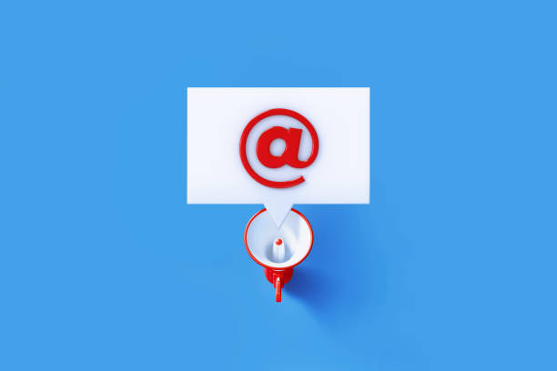 istock At Symbol Written White Speech Bubble Sits Over A Red Megaphone On Blue Background 1301850737