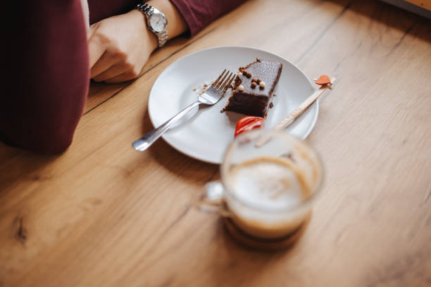 istock Enjoying coffee and cake in restaurant 1301857076