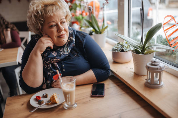 istock Enjoying sweet dessert in a coffee shop 1301857194
