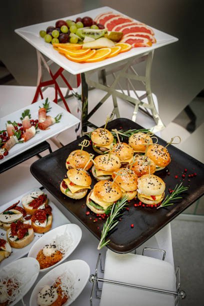 istock Catering banquet table with different food snacks and appetizers. 1301857744