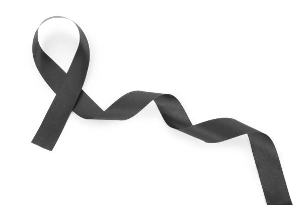 istock Black ribbon isolated on white 1301859823