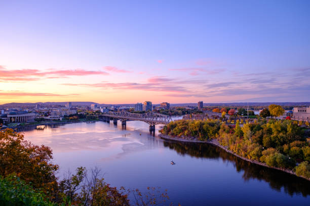 view of ottawa river at sunset - ottawa imagens e fotografias de stock