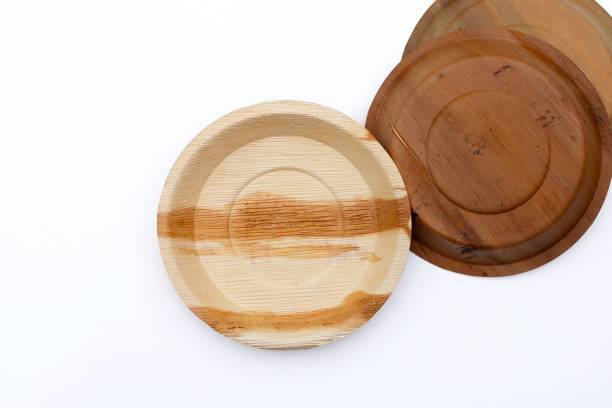 istock Betel palm leaf plates on white background. 1301868490