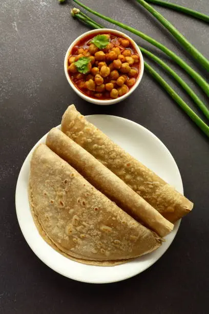 Healthy vegan diet food- wheat chapati served with chickpea channa,chana,masala curry,.