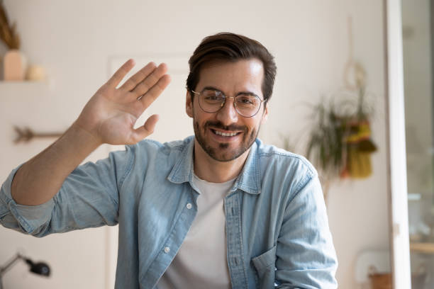 istock Young man video blogger looking at camera broadcasting from home 1301871031
