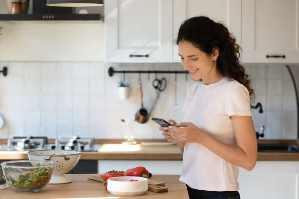 istock Smiling wife calling husband asking what to make for lunch 1301871057