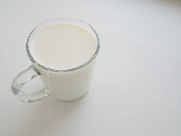 istock Glass cup with milk on a white background. Diet protein food 1301871197