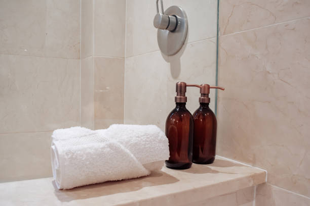 istock Amber glass shampoo bottles in a luxury minimalist bathroom. 1301876877