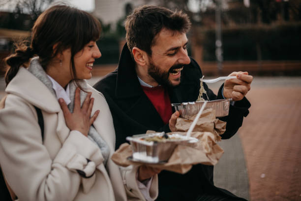 istock Chatting and unhealthy eating outdoors 1301880842